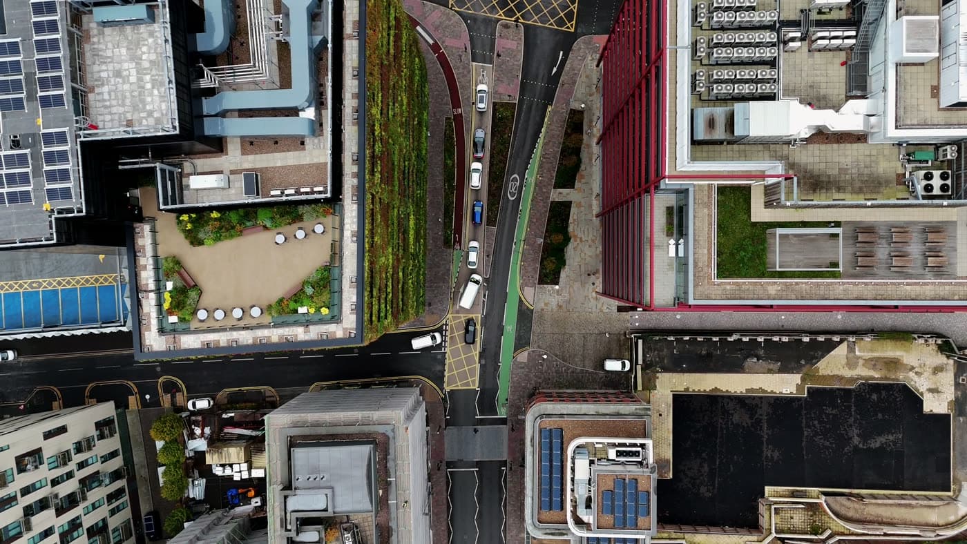 Drone shot looking straight down on Manchester rooftops and streets